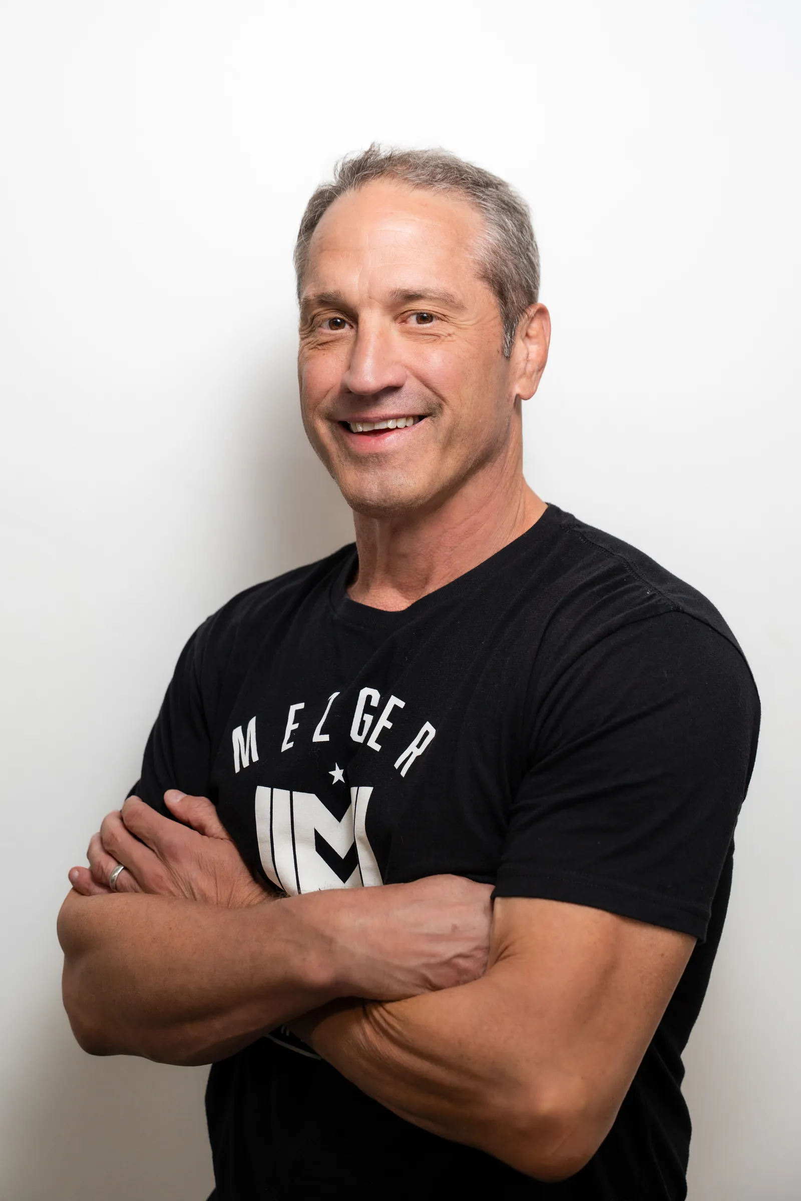 Guy Mezger, MMA head coach at Hidden Gym, in a Mezger Martial Arts shirt