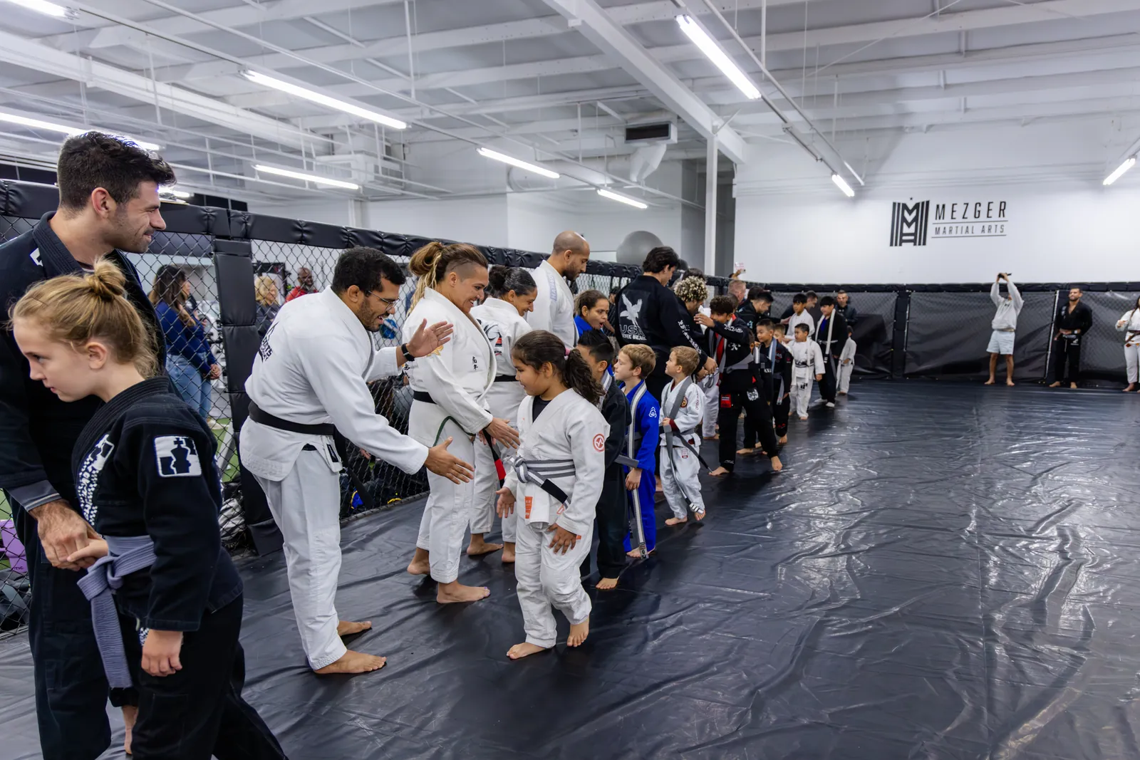 Kids in gis lined up on the mats during a martial arts class at Hidden Gym Richardson