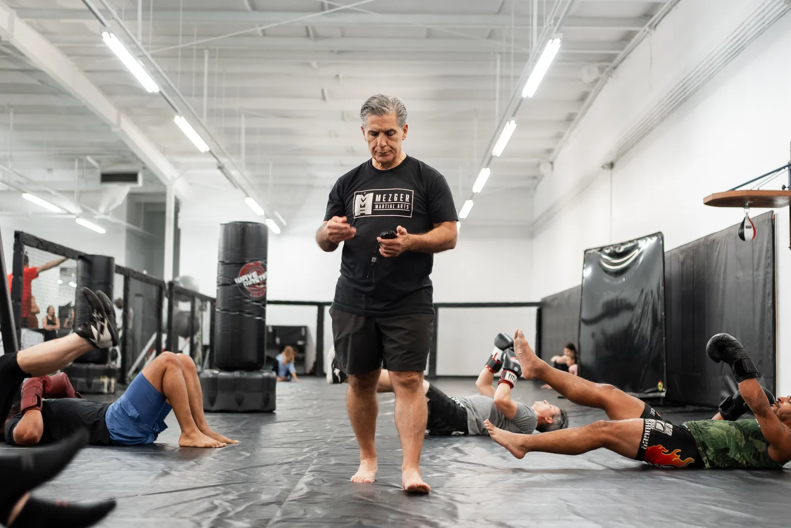 Guy Mezger coaching an MMA class through floor conditioning drills